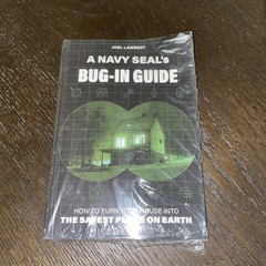 A Navy Seals BUG IN GUIDE SEALED but bent